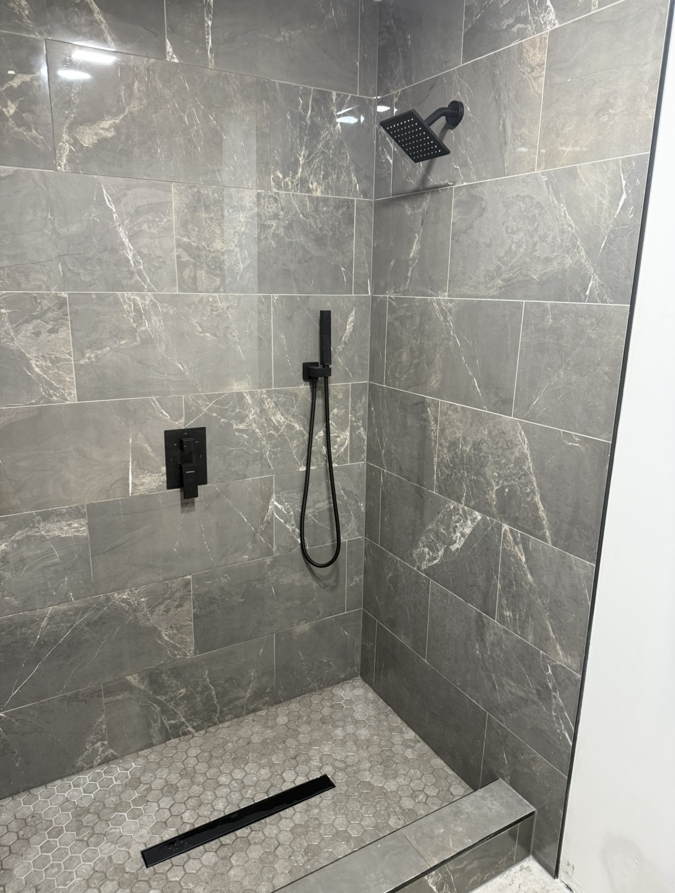 Gray marble tile walk-in shower